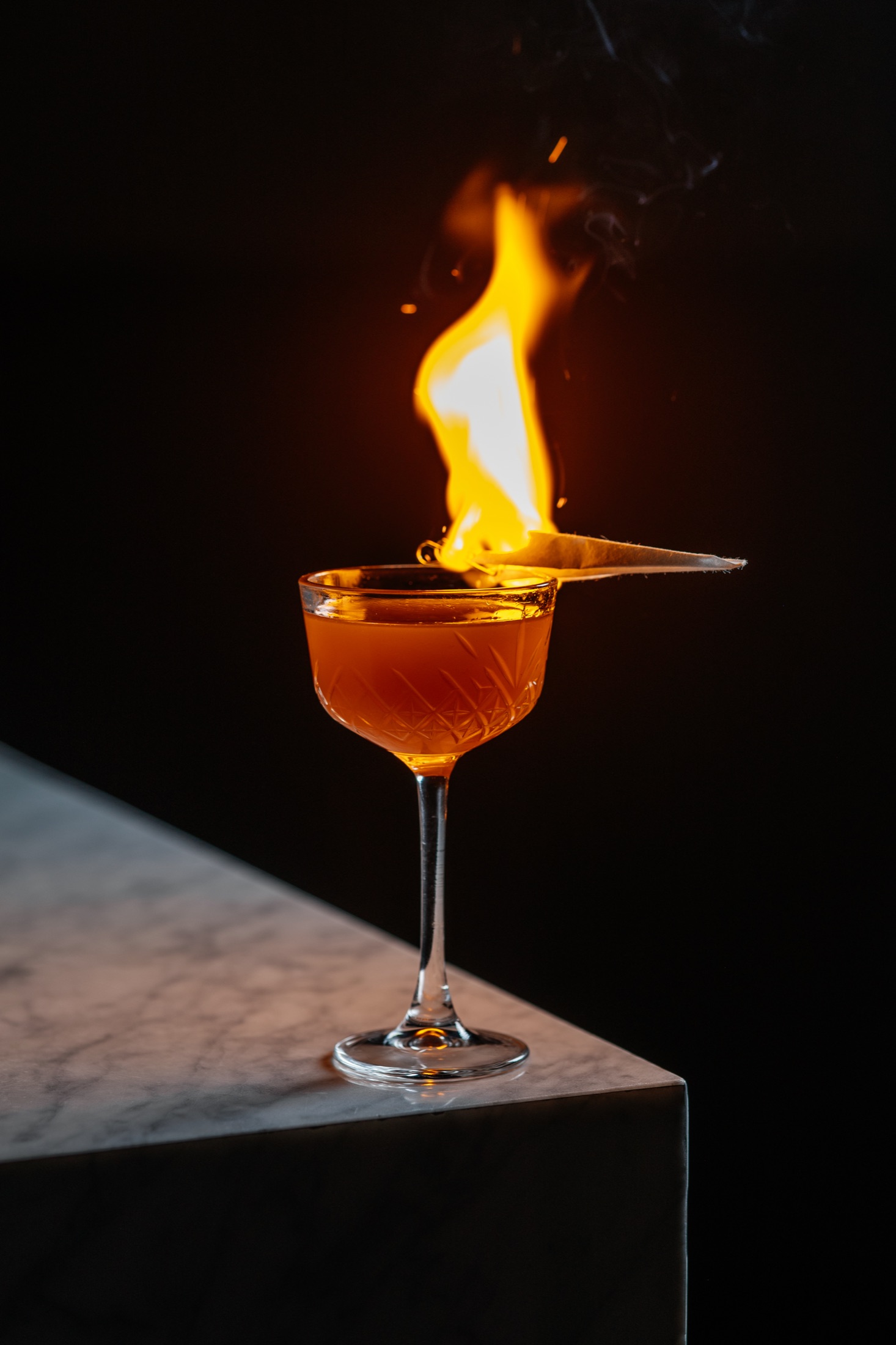 A cocktail flamed to order at the bar