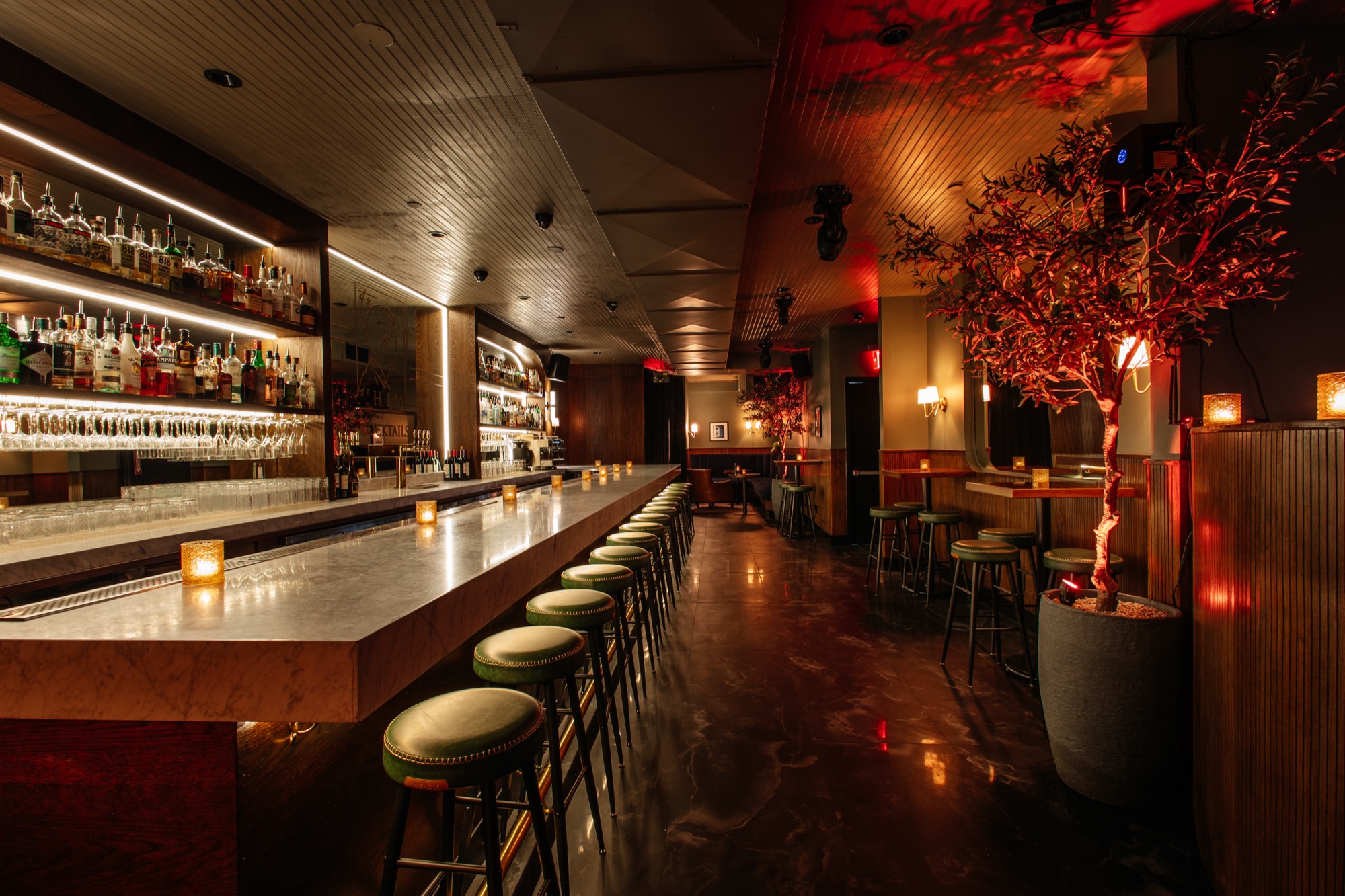 The candlelit bar at It's Him, set for a private affair