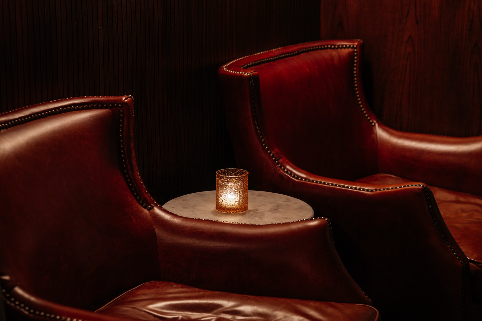 Red leather wingback chairs in the lounge
